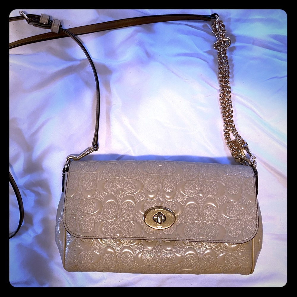 Beige Coach crossbody purse